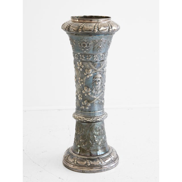 A substantial and exceptional Victorian silver vase of trumpet form, fully hallmarked with British assay marks dating to...