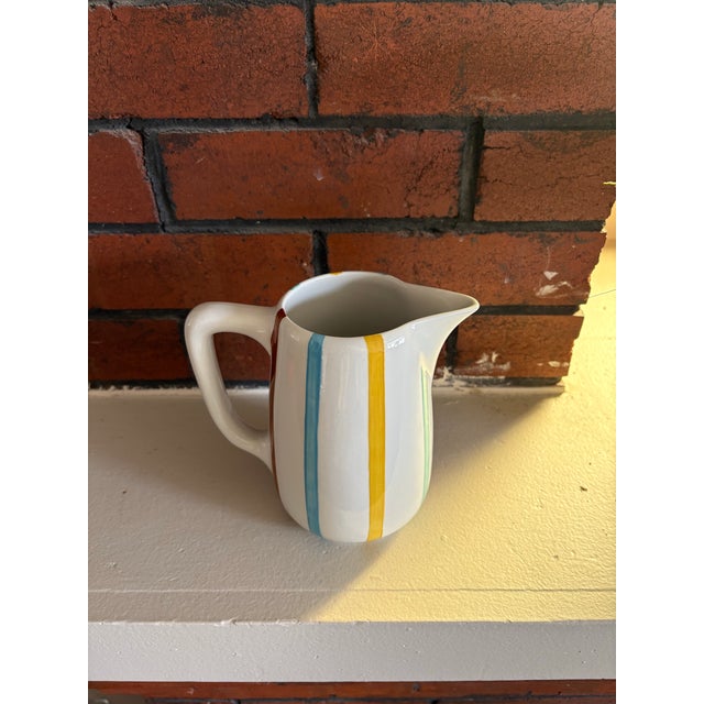 Vintage ceramic pitcher by De Sphinx (Petrus Regout), made in Holland and part of the Parafeu line. This hand-decorated...