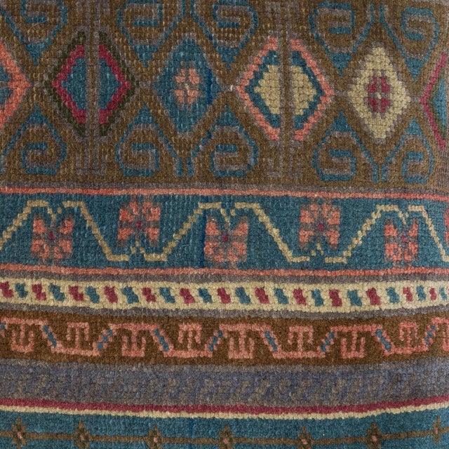 Add a touch of history and warmth to your space with this vintage handmade Turkish wool rug cushion cover. Crafted from...