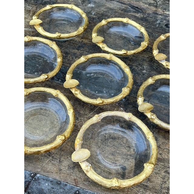 Elevate your tabletop with this radiant set of eight vintage individual ashtrays, a quintessential example of Hollywood...
