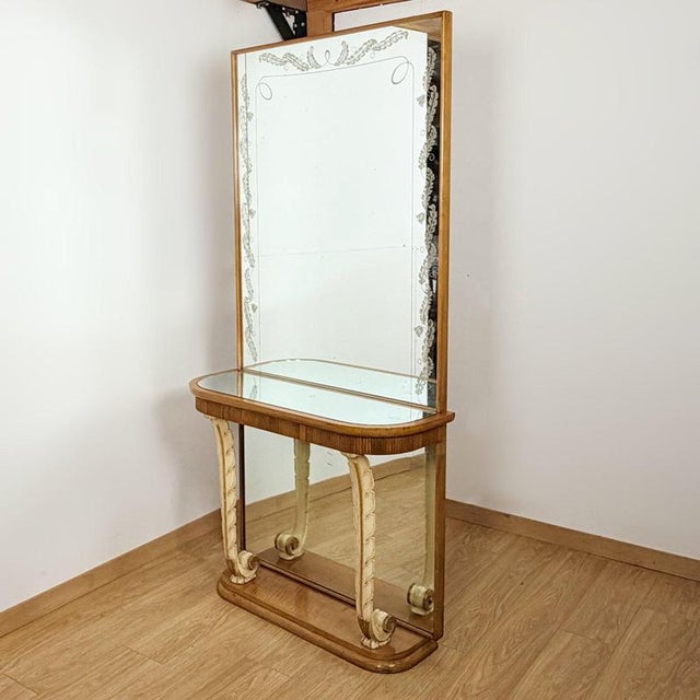 A mid-century italian mirrored console by osvaldo borsani. Walnut with original mirrored glass and a secret drawer...