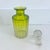 Antique perfume glass bottle with stopper. Gold tone details, cut glass stopper, ombre coloring from green to yellow to...