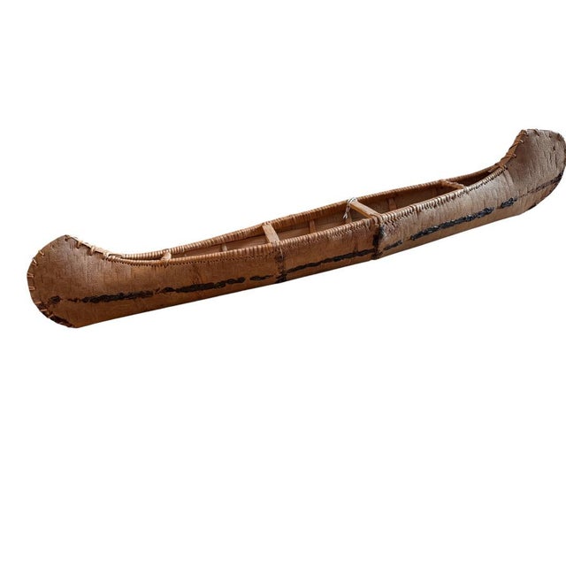 Vintage American Indian Canoe toy model made of birch bark from the Northern Woodland areas of the Eastern United States.