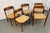 An iconic example of Danish Modern craftsmanship, these authentic Model 75 dining chairs were designed by renowned Danish...