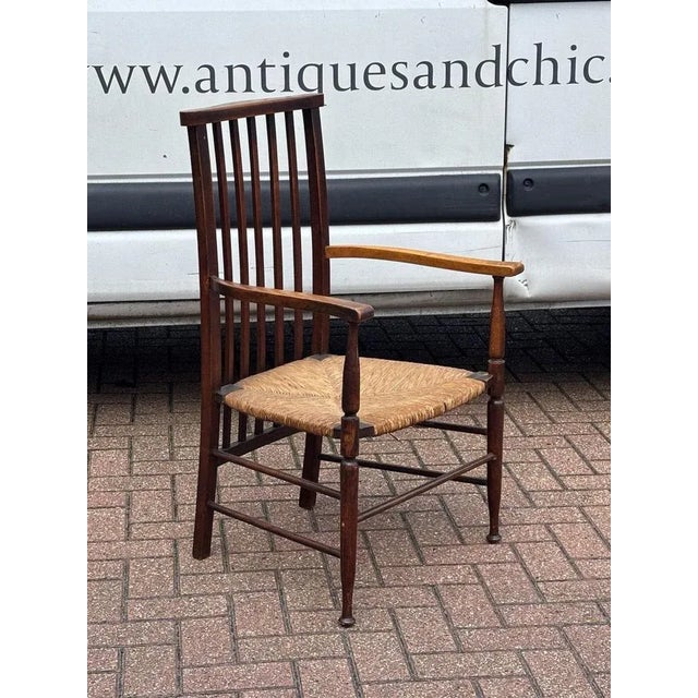 Arts + Crafts Morris and Co Armchair for Liberty of London 92 cms tall 55 cms wide 46 cms depth An antique so will have...