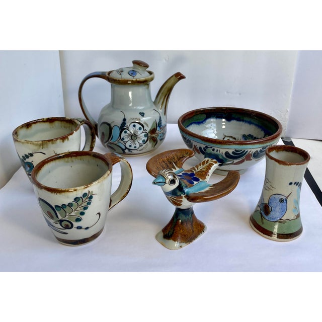 This is a wonderful collection of six pieces of antique pottery by Ken Edwards in the Tonala portray tradition. Decorated...
