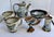 This is a wonderful collection of six pieces of antique pottery by Ken Edwards in the Tonala portray tradition. Decorated...