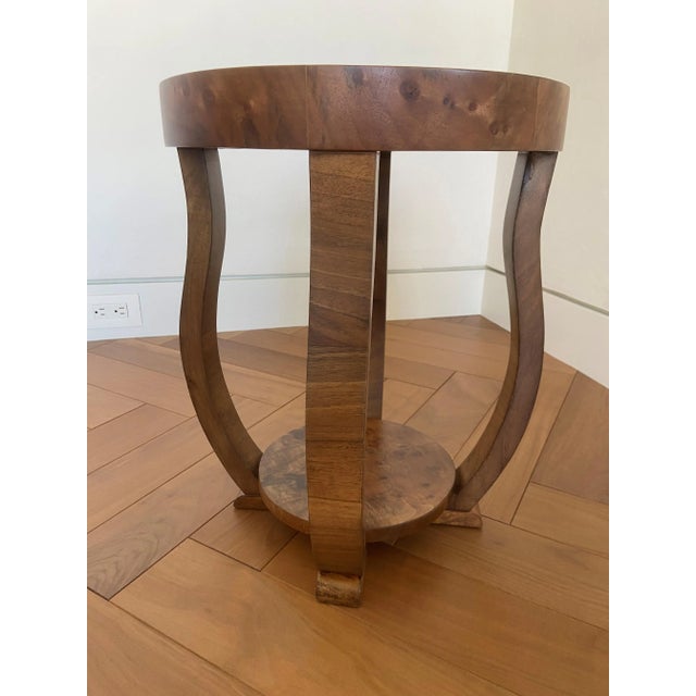 An elegant Austrian Biedermeier round side table, c.1830, crafted in burled walnut veneer with a sculptural, architectural...