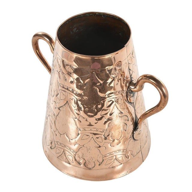 Copper handles vase from the 1920s. This piece is designed in the style of the selected designer and/or manufacturer