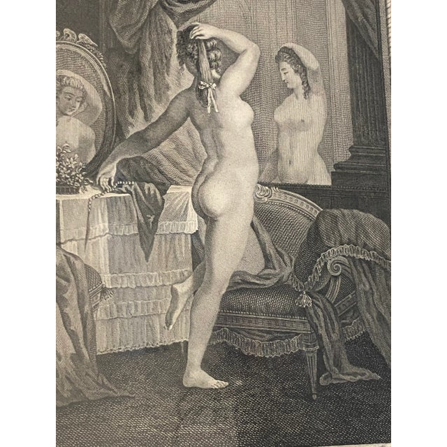 This is a wonderful engraving framed and matted and its original state. The image is titled 'Les Appas Multiples' and...