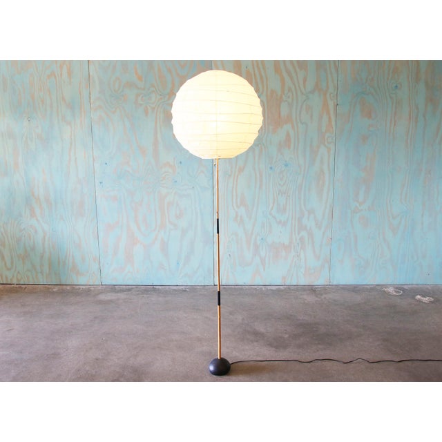 An original 1950s BB3 floor lamp by Isamu Noguchi. The original shade was torn, and thus updated with a new harp, and new...