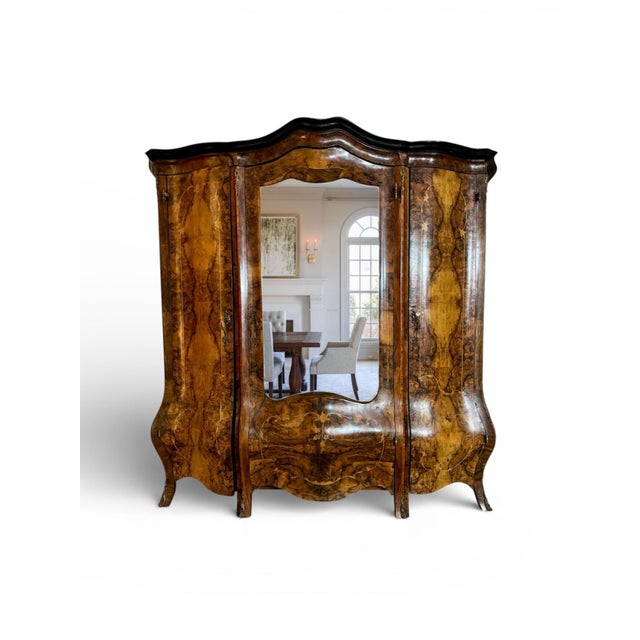Description A magnificent example of Italian Baroque Revival craftsmanship, this monumental triple armoire (circa...