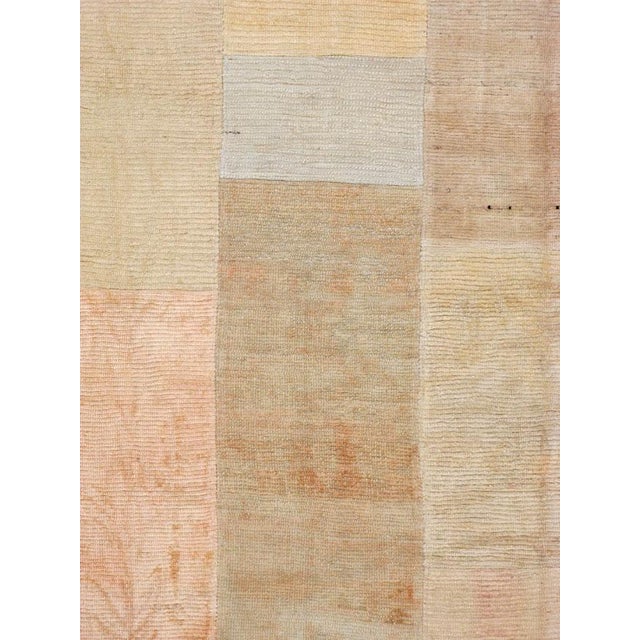 A Tulu carpet constructed of vintage Tulu carpets joined by hand-stitching. Measures: 9' 3" x 11' 11"