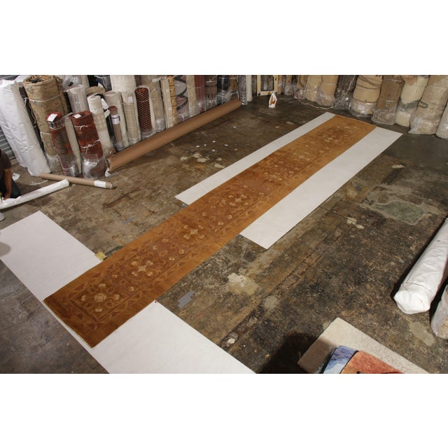 This handmade antique Amritsar runner rug is made from hand-knotted wool and measures 3’ x 18’, making it ideal for any...
