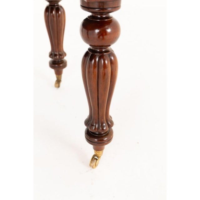 A fine william iv mahogany extending dining table, raised on classic william iv fluted and carved legs terminating in...