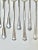 A charming mixed set of 13 vintage silverplate iced tea spoons featuring three different classic patterns. Their long...