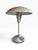 Striking vintage table lamp with a sleek silver-tone metal dome shade and streamlined pedestal base. The dramatic...
