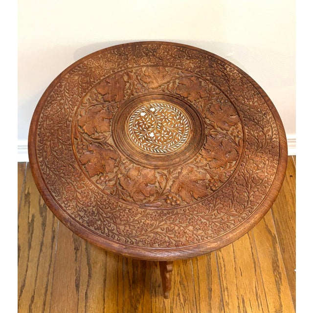 1940s-50s carved wood inlaid Indonesian style side table. Excellent condition.