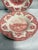 This set includes four vintage Johnson Brothers soup bowls featuring a classic red transferware design depicting a scenic...