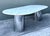 This monumental dining table is a masterclass in Postmodern luxury, showcasing the sleek, architectural aesthetic...