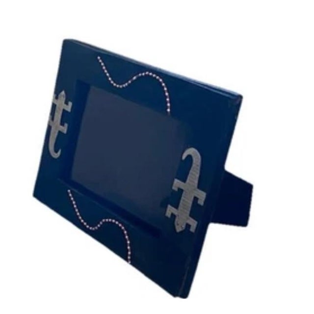 This product is an 8 x 10 black wooden frame embellished with African Besmo folk art, featuring lizards and beads....