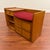 Vintage teak one-person bench with storage, made in the U.K. by Nathan Furniture circa 1970's. Designed for a corded...