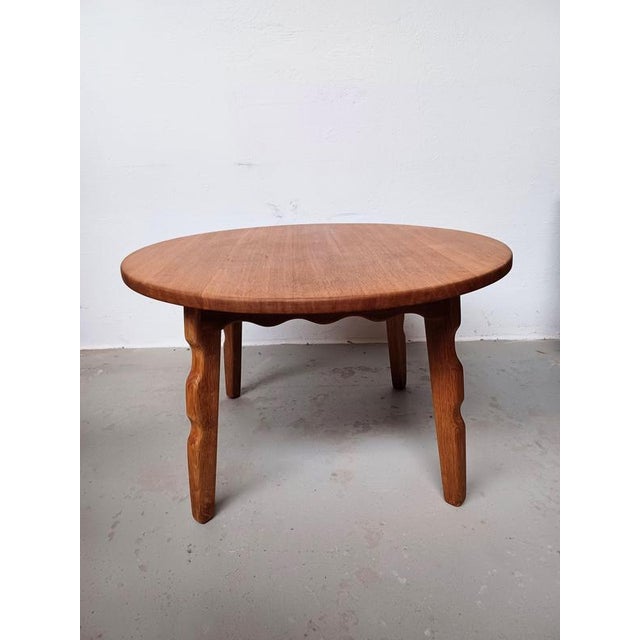 1960's refinished Brutalist oak coffee table attributed to Henning Kjærnulf and crafted by Tage Christensen The circular...