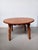 1960's refinished Brutalist oak coffee table attributed to Henning Kjærnulf and crafted by Tage Christensen The circular...