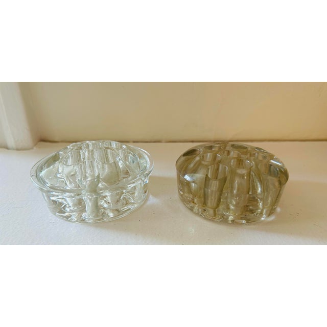Two glass 1950's flower frogs. 3.25 "wide. Great to put in bowl for flowers. They don't match.