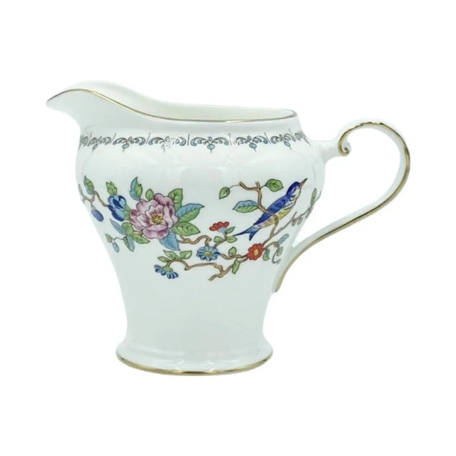 Details: -Creamer features a charming bird/floral motif w/lovely gold trim! -Hand-crafted in England -Reproduction of an...