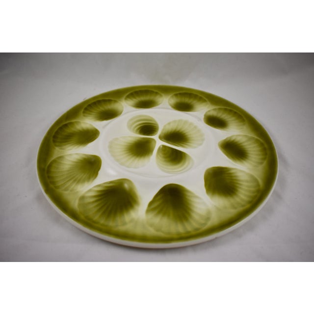 A Mid-Century Majolica glazed French faïence master Oyster serving platter, Orchies, circa 1950. Hand glazed in an ombre...