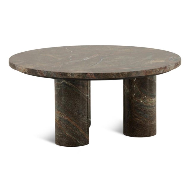 Gorgeous round brown bidasar marble coffee table with three cylindrical post legs. Each will vary in natural marble...