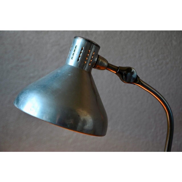 It possesses the quiet charm of objects with a soul. This beautiful Jumo GS1 desk lamp from the 1960s perfectly embodies...