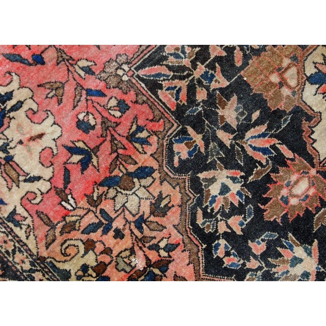 Handmade antique Persian Sarouk Farahan rug in original good condition. The rug is from the end of 19th century made in...