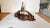 This is a rare Art Deco fruit basket, hand-carved in solid brown wood, likely made in France during the 1930s. The design...