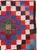 This mid-20th century Persian flatweave kilim rug presents a bold, graphic composition rooted in tribal weaving tradition....