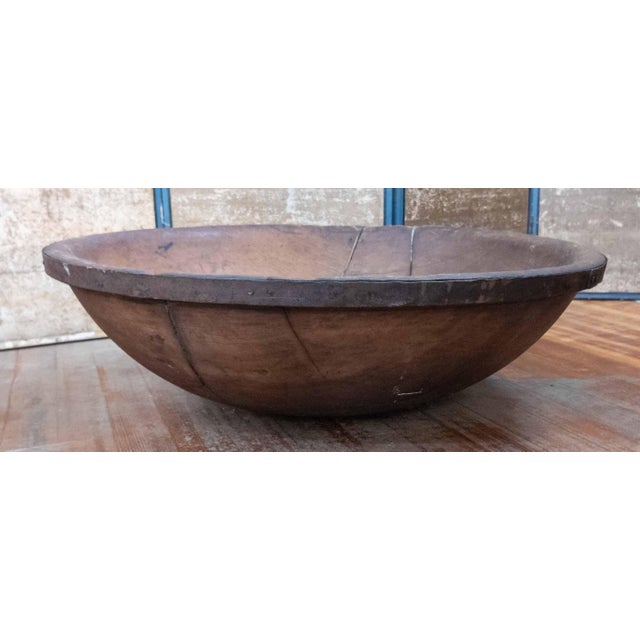 We are selling this large 19th century carved Wood bowl. This bowl has large dimensions and honest wear with a blacksmith...