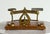 An English brass postal scale on its original hardwood base, of the type that sat on desks and in post offices when...