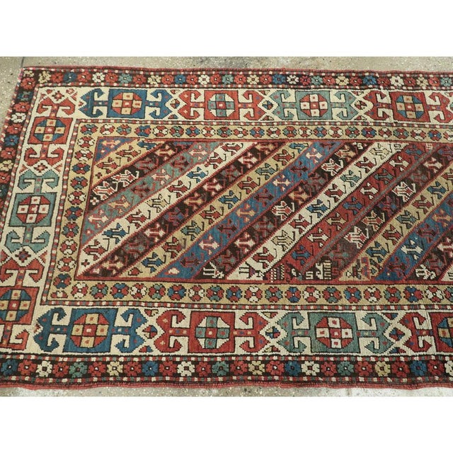 Textile Early 20th Century Handmade Caucasian Kazak Runner with a Tribal Design For Sale - Image 7 of 10