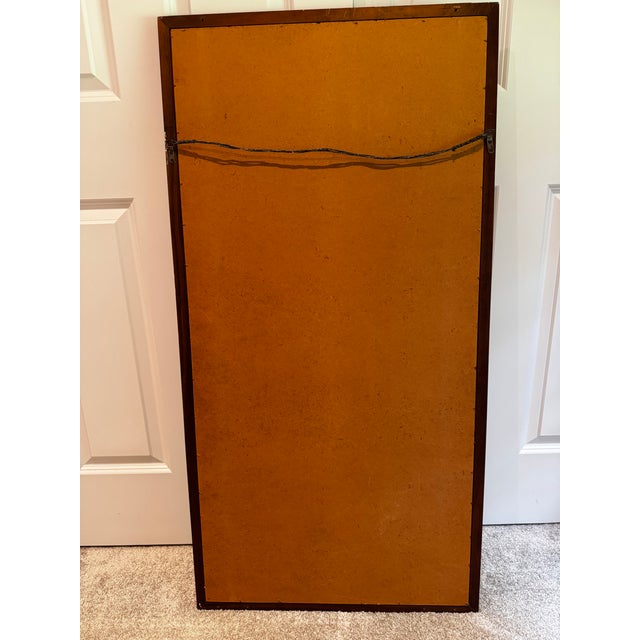Wall mirror designed by Jack Cartwright for Founders (1960's). It's comprised of a walnut frame with glass mirror. (heavy)...