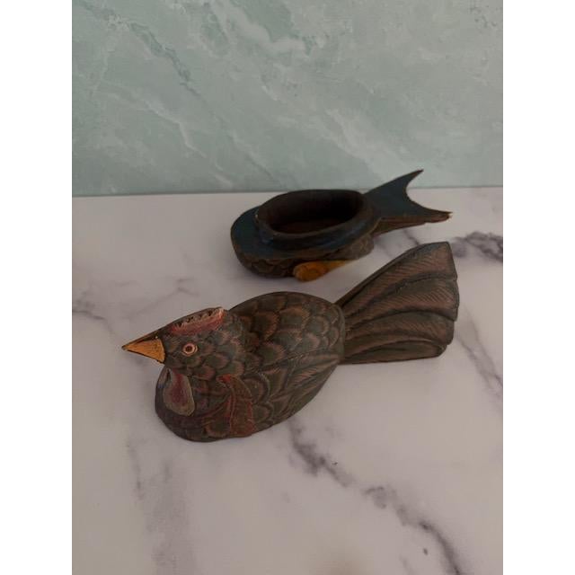 Beautiful hand-carved and hand-painted bird art box. Made of wood. Top comes off to reveal compartment inside for hiding...