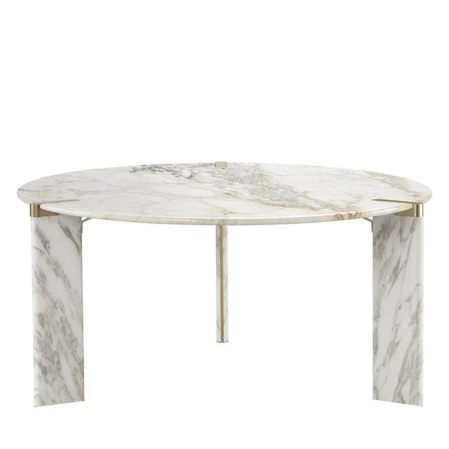 Seductive and unrepeatable gray veins emerge from a luminous white backdrop in this stunning round dining table fashioned...