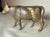 This Antique 1920's Cast Iron Gold Cow Still Bank by A.C. Williams is a unique and collectible piece with an exquisite...