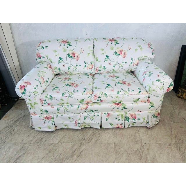 This vintage loveseat has been beautifully refreshed with a new floral upholstery that feels light, romantic, and...