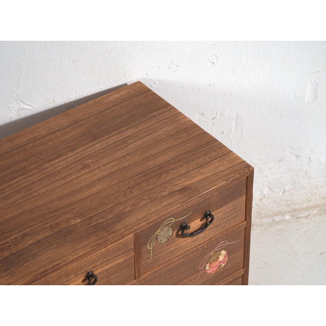 Small Japanese drawer cabinet crafted from paulownia wood (kiri) and made in Japan during the mid to late Showa period,...