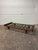 Modernized version of an African Senufo daybed. Made entirely of solid wood with mortise slats and tapered solid wood...