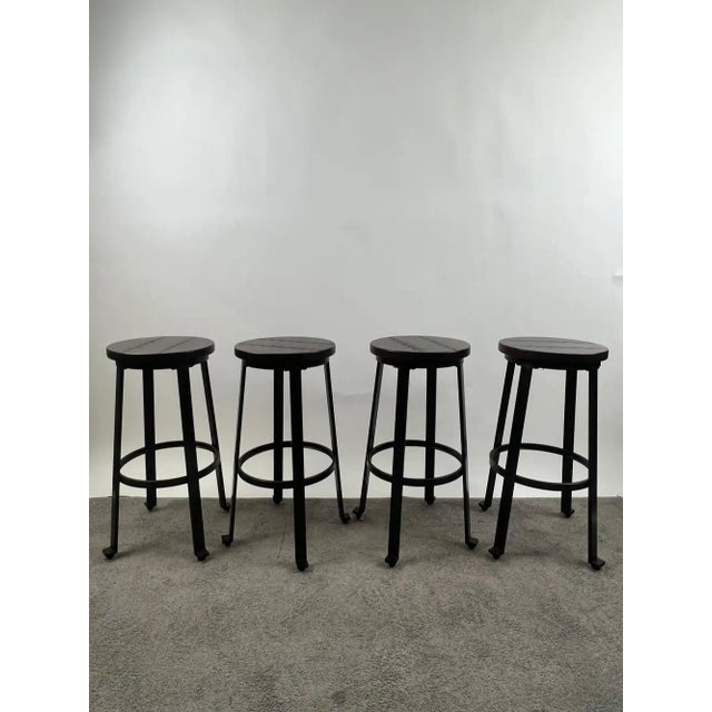 Vintage Industrial Style Round Wood Top Bar Stools w Black Iron Legs, Set of 4 This set of four industrial-style bar...