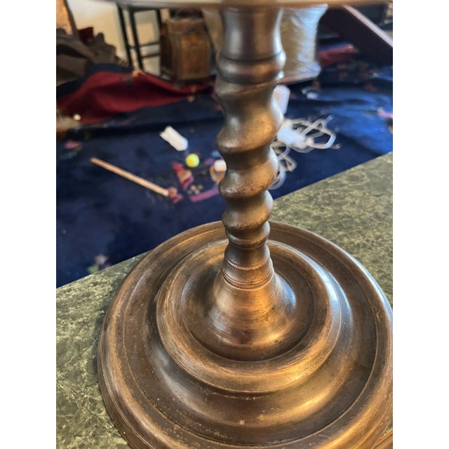 tall candelabra with a medievaltheme with a knight at the top and the lions holding the candles. all the accessories are...