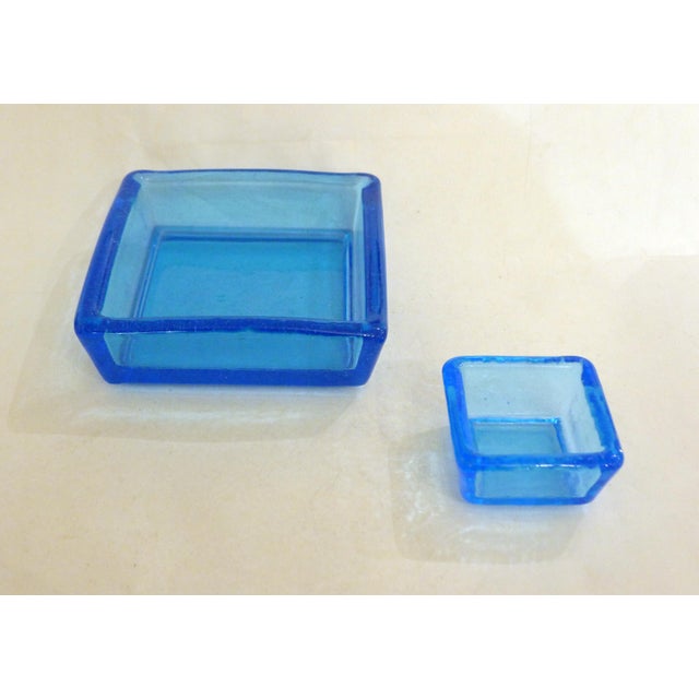 Pair of square trinket trays with small bases, straight edges with slightly irregular rounded corners, one large (15 x 15...