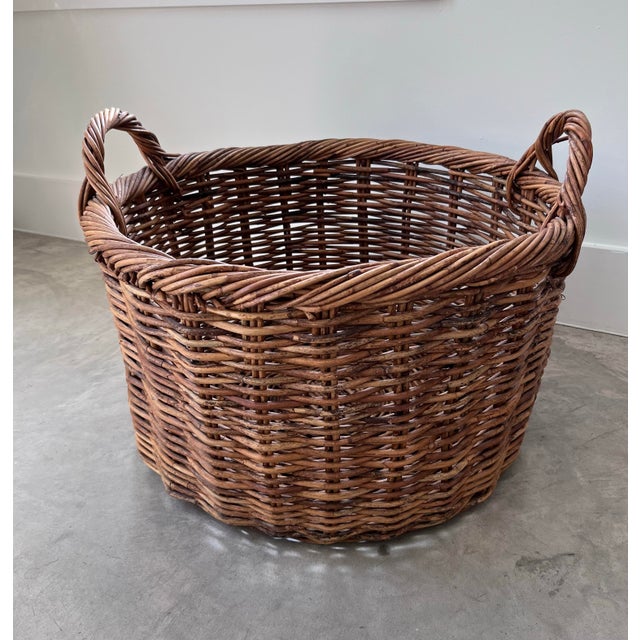 A beautiful vintage harvest gathering basket featuring double handles. The perfect piece to store blankets and beach...